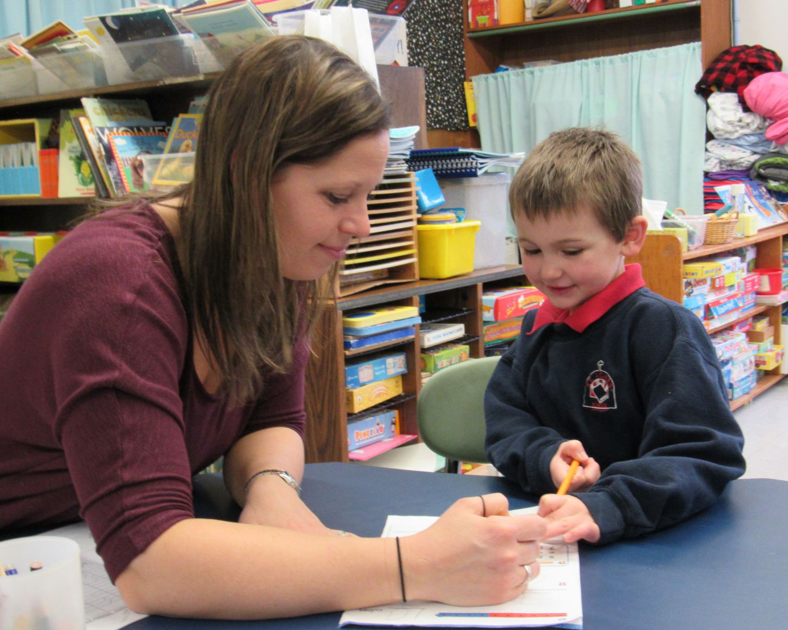 St. Agnes teacher working with student